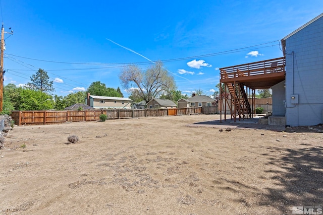 2066 Plumas St, Reno, NV 89509 - fenced backyard featuring stairs, a patio, and a wooden deck