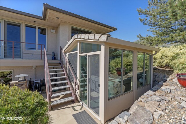 10286 Morning Song Trl, Reno, NV 89511 - doorway to property featuring stucco siding