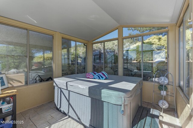 10286 Morning Song Trl, Reno, NV 89511 - sunroom featuring lofted ceiling, a jacuzzi, and stone finish flooring