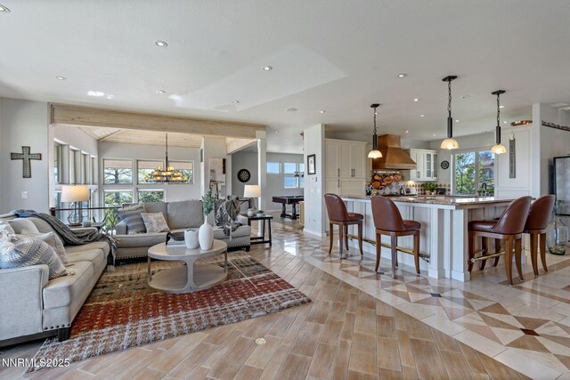 10286 Morning Song Trl, Reno, NV 89511 - living room with healthy amount of natural light, recessed lighting, a chandelier, and baseboards
