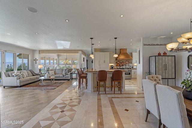 10286 Morning Song Trl, Reno, NV 89511 - living area featuring a chandelier, recessed lighting, and a skylight