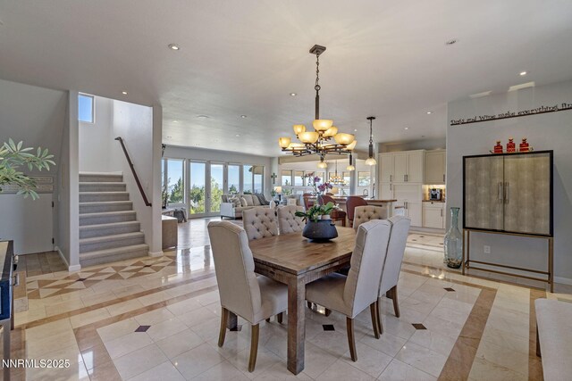 10286 Morning Song Trl, Reno, NV 89511 - dining area featuring inlaid floor details, light tile patterned floors, a chandelier, recessed lighting, and stairs