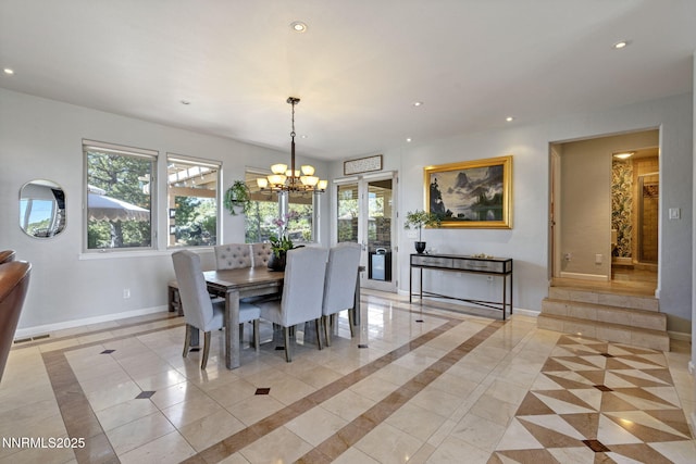 10286 Morning Song Trl, Reno, NV 89511 - dining room featuring baseboards, a chandelier, recessed lighting, light tile patterned floors, and inlaid floor details
