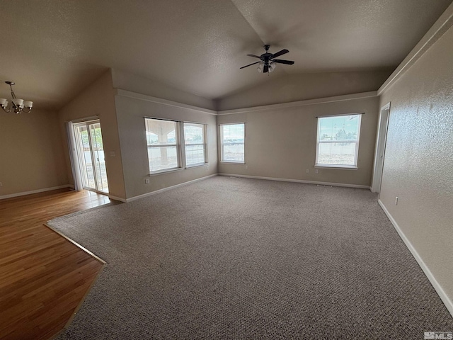5740 Sarah Rd, Fallon, NV 89406 - spare room featuring lofted ceiling, a ceiling fan, a chandelier, baseboards, and wood finished floors
