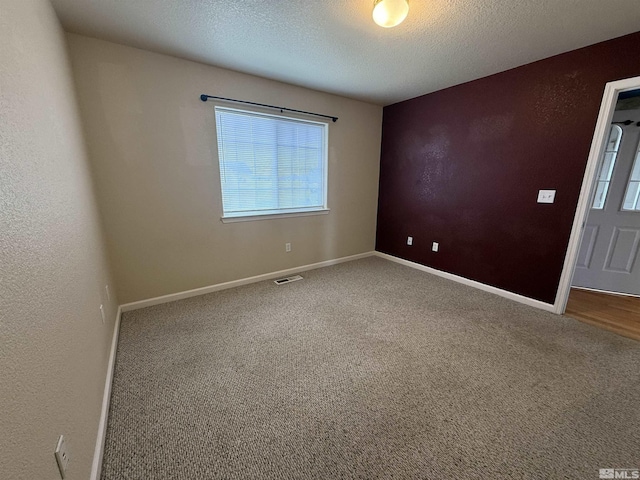 5740 Sarah Rd, Fallon, NV 89406 - unfurnished room featuring carpet floors, baseboards, and a textured ceiling