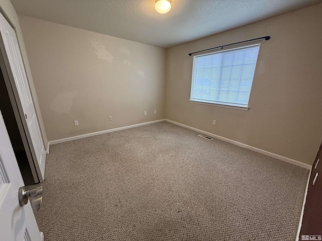 5740 Sarah Rd, Fallon, NV 89406 - spare room with carpet flooring, a textured ceiling, and baseboards