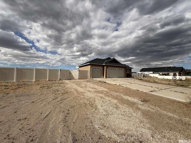 5740 Sarah Rd, Fallon, NV 89406 - exterior space featuring fence, driveway, and a gate