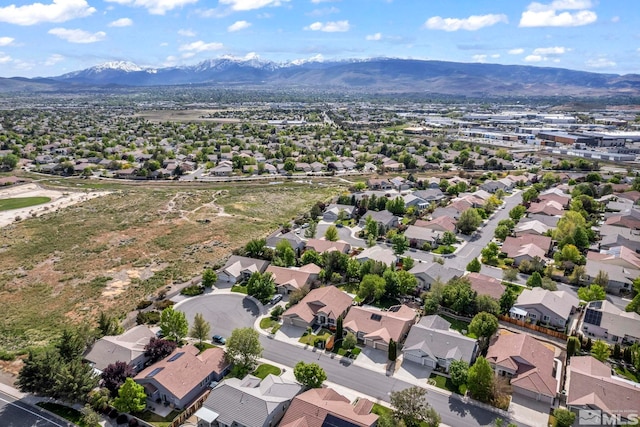 aerial view of residential area with a mountain backdrop
