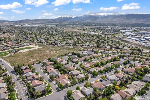 aerial view of property's location featuring mountains and nearby suburban area