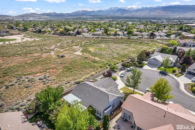 aerial perspective of suburban area featuring a mountain backdrop