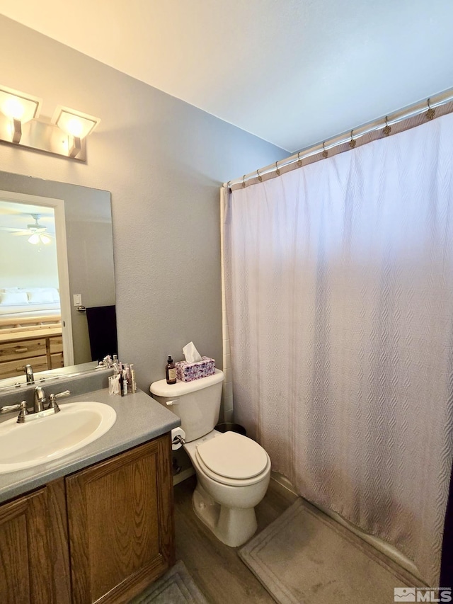961 Ruddy Ct, Sparks, NV 89441 - full bath featuring vanity, toilet, a ceiling fan, and curtained shower