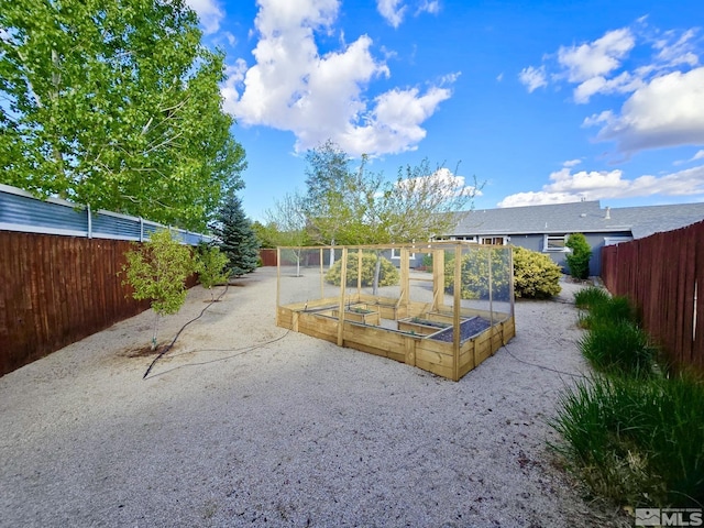 961 Ruddy Ct, Sparks, NV 89441 - view of yard featuring a vegetable garden and fence