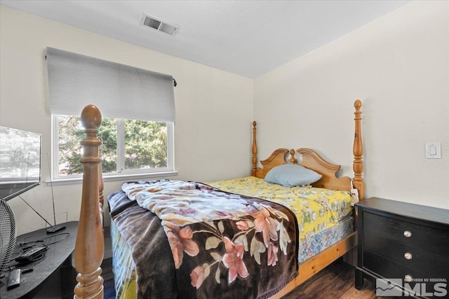bedroom featuring wood finished floors