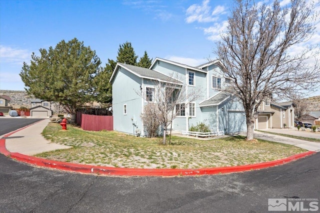 traditional-style home with a garage and driveway