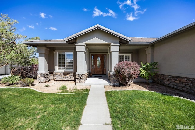 6570 Rey Del Sierra Ct, Sparks, NV 89436 - entrance to property with stone siding, stucco siding, and a yard