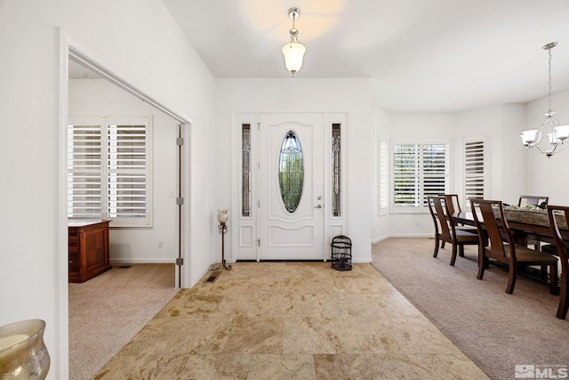6570 Rey Del Sierra Ct, Sparks, NV 89436 - foyer entrance with carpet, a chandelier, and baseboards