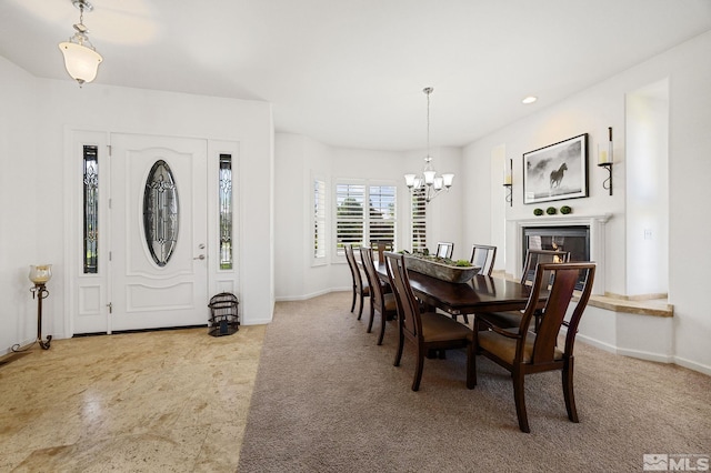 6570 Rey Del Sierra Ct, Sparks, NV 89436 - dining space with a chandelier, baseboards, recessed lighting, a glass covered fireplace, and carpet