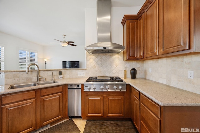 6570 Rey Del Sierra Ct, Sparks, NV 89436 - kitchen featuring a sink, wall chimney exhaust hood, a ceiling fan, stainless steel gas cooktop, and brown cabinetry