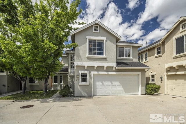 2190 Canyon Mesa Ct, Reno, NV 89523 - traditional home featuring stucco siding, an attached garage, and driveway
