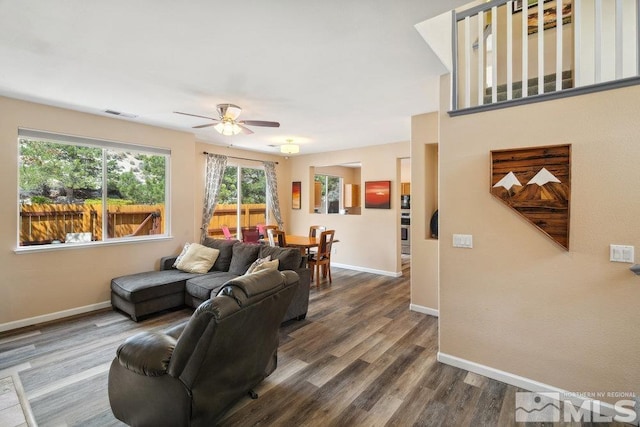 2190 Canyon Mesa Ct, Reno, NV 89523 - living room featuring baseboards, a ceiling fan, and dark wood-style floors