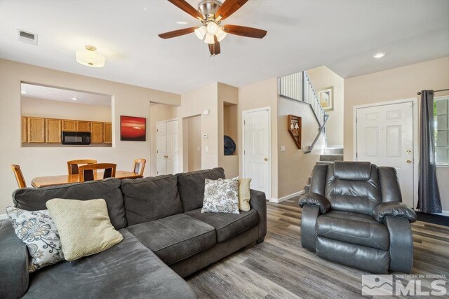 2190 Canyon Mesa Ct, Reno, NV 89523 - living room featuring wood finished floors, ceiling fan, baseboards, stairs, and recessed lighting