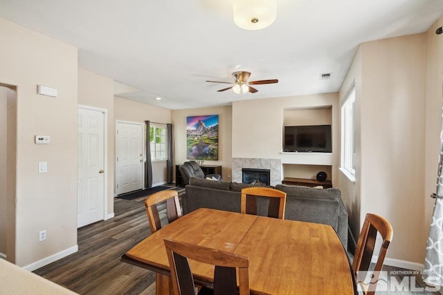 2190 Canyon Mesa Ct, Reno, NV 89523 - dining room featuring baseboards, a tiled fireplace, ceiling fan, and wood finished floors