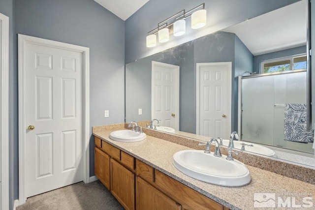 2190 Canyon Mesa Ct, Reno, NV 89523 - full bath featuring vaulted ceiling, a shower with door, and double vanity