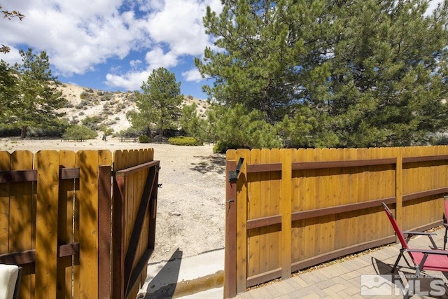 2190 Canyon Mesa Ct, Reno, NV 89523 - view of yard with fence and a mountain view