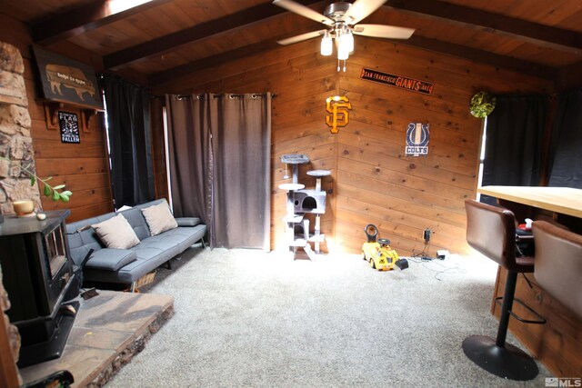 435 Shipley Dr, Yerington, NV 89447 - carpeted living area with wood ceiling, wood walls, and ceiling fan