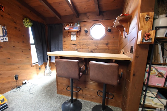435 Shipley Dr, Yerington, NV 89447 - dining space with wood walls, wooden ceiling, beam ceiling, and carpet flooring