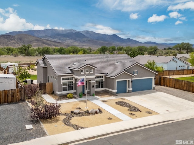 1523 Riverpark Pkwy, Dayton, NV 89403 - traditional home with stucco siding, an attached garage, and fence