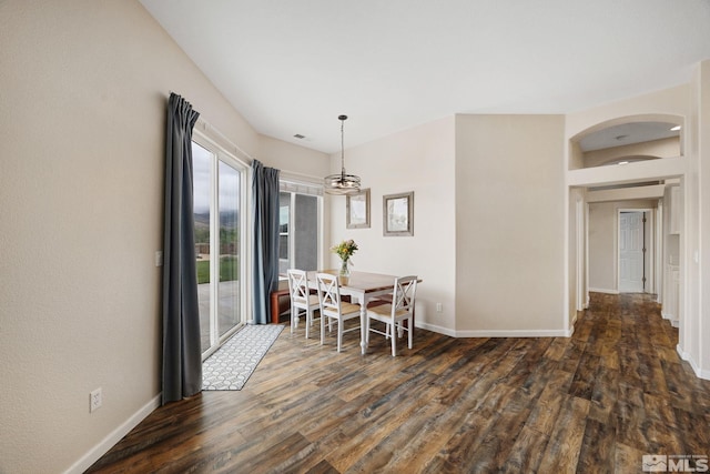 1523 Riverpark Pkwy, Dayton, NV 89403 - dining area with dark wood-style floors, baseboards, and arched walkways