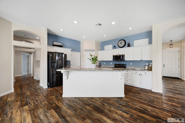 1523 Riverpark Pkwy, Dayton, NV 89403 - kitchen with stainless steel appliances, light stone counters, white cabinetry, and recessed lighting