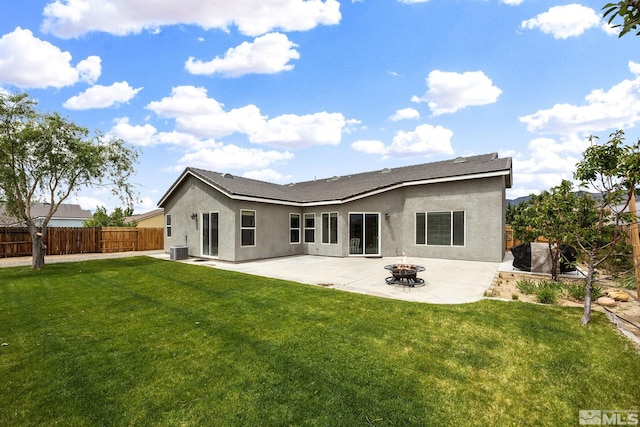 1523 Riverpark Pkwy, Dayton, NV 89403 - rear view of property with a patio area, stucco siding, central air condition unit, and a fire pit