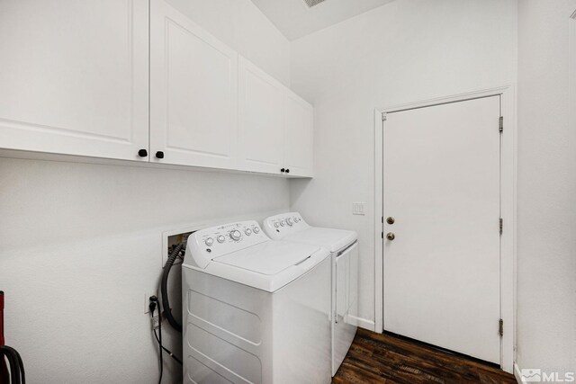1523 Riverpark Pkwy, Dayton, NV 89403 - washroom with cabinet space, washer and clothes dryer, and dark wood-type flooring