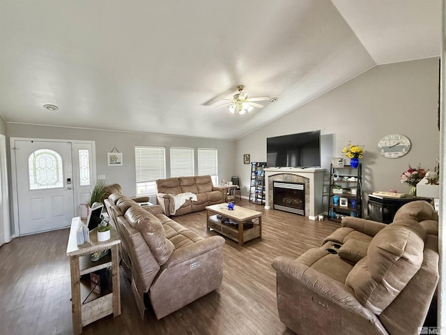 660 Castle Way, Winnemucca, NV 89445 - living room featuring lofted ceiling, ceiling fan, wood finished floors, and a fireplace