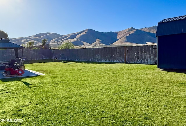 660 Castle Way, Winnemucca, NV 89445 - view of yard with a gazebo, a patio area, and a mountain view