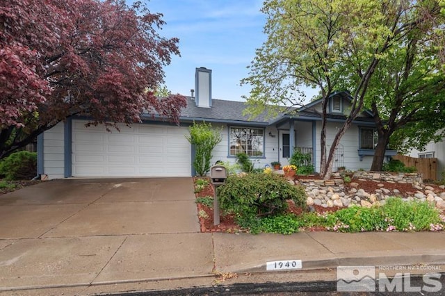 1940 Peavine Rd, Reno, NV 89503 - view of front of house with a chimney, a garage, and concrete driveway