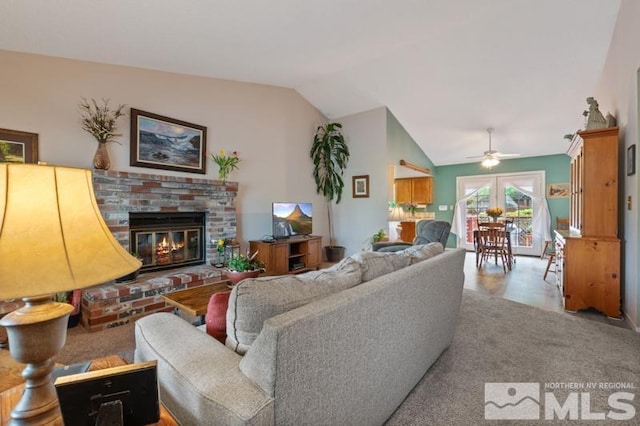 1940 Peavine Rd, Reno, NV 89503 - living area featuring vaulted ceiling, ceiling fan, and a fireplace