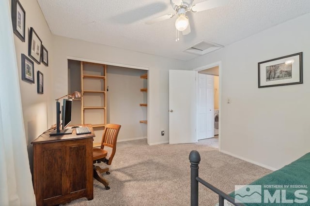 1940 Peavine Rd, Reno, NV 89503 - office area with attic access, a textured ceiling, washer / clothes dryer, light carpet, and ceiling fan