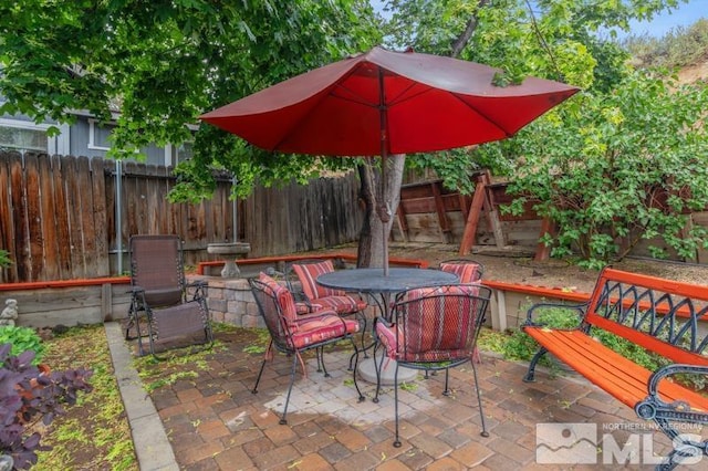 1940 Peavine Rd, Reno, NV 89503 - view of patio featuring a fenced backyard and outdoor dining space