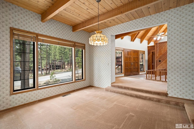 unfurnished dining area featuring wallpapered walls, wood ceiling, carpet, a ceiling fan, and baseboards