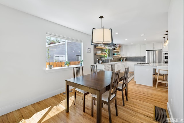 2480 Idlewild Dr, Reno, NV 89509 - dining room with baseboards, light wood-type flooring, and recessed lighting