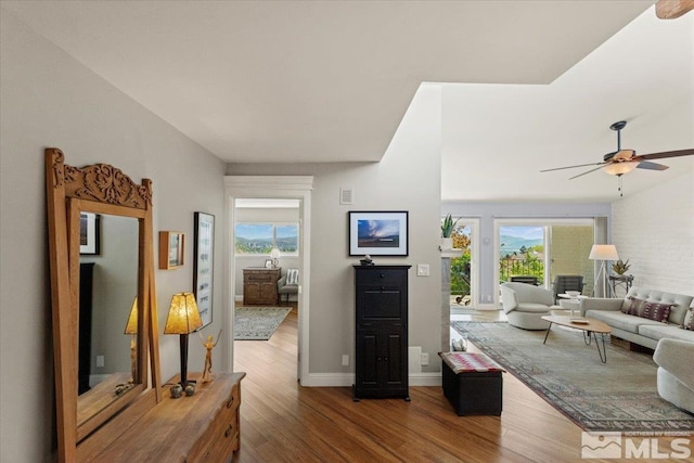 3425 Skyline Blvd, Reno, NV 89509 - living room featuring wood finished floors, a ceiling fan, and healthy amount of natural light