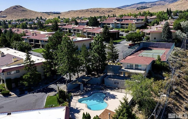 3425 Skyline Blvd, Reno, NV 89509 - aerial perspective of suburban area with a mountainous background and a pool area