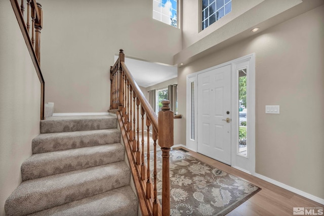 5245 Canyon View Dr, Sparks, NV 89436 - foyer entrance featuring wood finished floors, baseboards, stairs, and a high ceiling