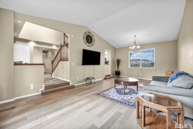 5245 Canyon View Dr, Sparks, NV 89436 - living area with wood finished floors, a chandelier, stairs, vaulted ceiling, and baseboards