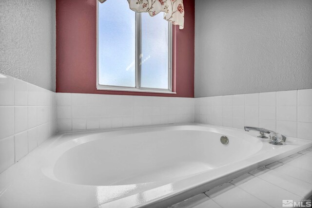 5245 Canyon View Dr, Sparks, NV 89436 - bathroom with a textured wall and a bath