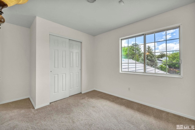 5245 Canyon View Dr, Sparks, NV 89436 - unfurnished bedroom with carpet floors, a closet, and baseboards