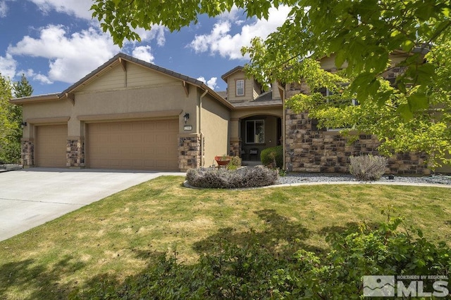 view of front of home featuring a garage, a front yard, stone siding, driveway, and stucco siding